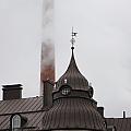 Paper factory with it's high chimney as dominant of the city